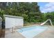 Backyard features a pool with slide at 410 Bowen Ne Rd, White, GA 30184