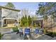 Beautiful backyard featuring a stone patio, fire pit, and comfortable seating for outdoor relaxation and entertainment at 100 Daniel Se Ave, Atlanta, GA 30317