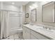 Bright bathroom with double vanity, large mirror, and shower/tub combo at 100 Daniel Se Ave, Atlanta, GA 30317