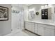 Elegant bathroom with a glass-enclosed shower, double vanity, and marble countertops at 100 Daniel Se Ave, Atlanta, GA 30317