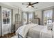 Bedroom with hardwood floors, lots of windows, and soft neutral decor at 100 Daniel Se Ave, Atlanta, GA 30317