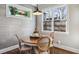 Dining area features a vintage table with seating for four, accent wall, and lots of natural light at 100 Daniel Se Ave, Atlanta, GA 30317