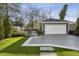 Detached garage with a well-manicured lawn, creating a clean and organized space at 100 Daniel Se Ave, Atlanta, GA 30317