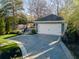 Detached two-car garage with private driveway and a neatly landscaped yard at 100 Daniel Se Ave, Atlanta, GA 30317