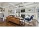 Bright living room with a fireplace, built-in bookshelves, and coffered ceilings at 100 Daniel Se Ave, Atlanta, GA 30317