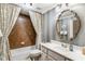 Clean bathroom with a shower-tub combination and a vanity with a large mirror at 12710 Old Surrey Pl, Roswell, GA 30075