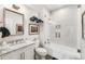 Bright bathroom featuring marble countertop vanity, walk-in shower, and modern fixtures at 12710 Old Surrey Pl, Roswell, GA 30075