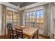 Dining room area with view of deck, including hardwood floors, and natural lighting at 12710 Old Surrey Pl, Roswell, GA 30075