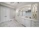 Stylish bathroom with double vanity, granite countertops, and modern lighting fixtures at 12710 Old Surrey Pl, Roswell, GA 30075