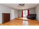 Cozy bedroom featuring hardwood floors, natural light, and neutral wall colors at 1850 Cashmere Ct, Lithonia, GA 30058