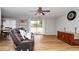 Bright living room featuring hardwood floors, neutral wall colors, and a sliding glass door at 1850 Cashmere Ct, Lithonia, GA 30058