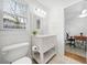 Well-lit bathroom featuring a classic vanity, natural light, and functional design at 2796 Georgian W Dr, Brookhaven, GA 30341