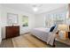 Cozy bedroom featuring ample natural light from two windows and a neutral color palette at 2796 Georgian W Dr, Brookhaven, GA 30341