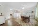 Elegant dining room with hardwood floors, a modern rug, and ample natural light at 2796 Georgian W Dr, Brookhaven, GA 30341