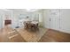 Airy dining area featuring hardwood floors, stylish decor, and a seamless flow into other living spaces at 2796 Georgian W Dr, Brookhaven, GA 30341