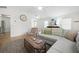 Comfortable living room featuring hardwood floors, neutral decor, and a ceiling fan for added comfort at 2796 Georgian W Dr, Brookhaven, GA 30341