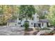 Backyard view of the home featuring a gazebo, patio, and well-maintained landscaping at 7185 Peachtree Dunwoody Rd, Atlanta, GA 30328