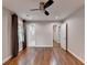 Spacious bedroom features hardwood floors, neutral paint, and an updated ceiling fan at 7185 Peachtree Dunwoody Rd, Atlanta, GA 30328