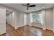 Bright bedroom with large window, hardwood floors, neutral paint, and views to the backyard at 7185 Peachtree Dunwoody Rd, Atlanta, GA 30328