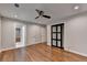 This bedroom features hardwood floors, neutral paint, a ceiling fan, and closet at 7185 Peachtree Dunwoody Rd, Atlanta, GA 30328