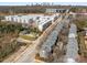Wide aerial view of a modern townhome community in an urban area, showcasing its layout and surroundings at 1126 Park Row South Se, Atlanta, GA 30312