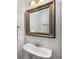 Charming half-bathroom with a vintage-style mirror and pedestal sink at 1126 Park Row South Se, Atlanta, GA 30312