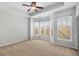 Large bedroom with carpeted floors, tray ceilings, and lots of natural light at 1126 Park Row South Se, Atlanta, GA 30312