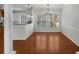 Bright dining room featuring hardwood floors, large windows, and modern lighting fixture at 1126 Park Row South Se, Atlanta, GA 30312