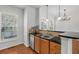 Kitchen area with stainless steel sink, chandelier, and natural light at 1126 Park Row South Se, Atlanta, GA 30312