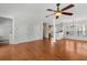 Open living room with hardwood floors, ceiling fan, and plenty of natural light at 1126 Park Row South Se, Atlanta, GA 30312