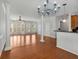 Open-concept living area with hardwood floors and large bay windows at 1126 Park Row South Se, Atlanta, GA 30312