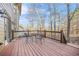 Inviting wooden deck with outdoor seating, perfect for relaxing and entertaining guests at 1331 Ashbury Park Dr, Hoschton, GA 30548