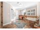 Bright bathroom featuring a soaking tub, tile floors, granite counters, and shutters at 1331 Ashbury Park Dr, Hoschton, GA 30548