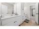 Bathroom with tile flooring, white cabinets, and an ensuite bedroom at 1331 Ashbury Park Dr, Hoschton, GA 30548