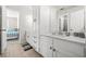 Bathroom with tile flooring, white cabinets, and ensuite bedroom at 1331 Ashbury Park Dr, Hoschton, GA 30548