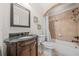 Bathroom with an arched shower head, decorative tile accents, and granite countertops at 1331 Ashbury Park Dr, Hoschton, GA 30548