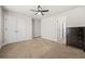 Bedroom with neutral carpet, closet doors and ensuite bathroom at 1331 Ashbury Park Dr, Hoschton, GA 30548