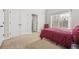 Bedroom features neutral carpet, double door closet, and window at 1331 Ashbury Park Dr, Hoschton, GA 30548