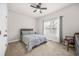 Bedroom featuring a ceiling fan, a large window, and neutral paint at 1331 Ashbury Park Dr, Hoschton, GA 30548