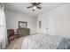 Bedroom with a large window, ceiling fan, and neutral paint at 1331 Ashbury Park Dr, Hoschton, GA 30548