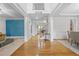 Bright foyer features hardwood floors, staircase and large opening to other rooms at 1331 Ashbury Park Dr, Hoschton, GA 30548