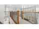 Hallway with carpet and wood and iron railing at 1331 Ashbury Park Dr, Hoschton, GA 30548