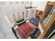 Open living room with high ceilings, large windows, and a fireplace at 1331 Ashbury Park Dr, Hoschton, GA 30548