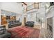 Spacious living room with fireplace, high ceilings and access to the kitchen at 1331 Ashbury Park Dr, Hoschton, GA 30548