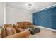 Comfortable living room with neutral carpet, modern lighting and accent wall at 1331 Ashbury Park Dr, Hoschton, GA 30548