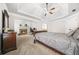 Spacious main bedroom featuring a tray ceiling, carpet, and a fireplace at 1331 Ashbury Park Dr, Hoschton, GA 30548