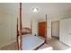 Cozy bedroom featuring a four-poster bed, wardrobe, and a door leading to another room at 1800 Clairmont Lk # A326, Decatur, GA 30033