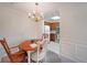 Dining area with chandelier and view into the adjacent kitchen at 1800 Clairmont Lk # A326, Decatur, GA 30033
