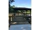 Waterfront gazebo on a wooden pier with beautiful lake views and ample seating for relaxation at 1800 Clairmont Lk # A326, Decatur, GA 30033