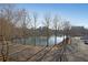 Scenic lake view surrounded by trees and a parking area under a clear sky at 1800 Clairmont Lk # A326, Decatur, GA 30033